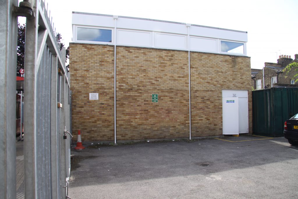 The Parking Area looking towards to the centre north wall, showing the fire exit