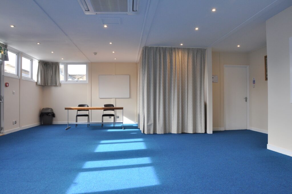 The Conference Room, showing the door to the stairs, curtained off
